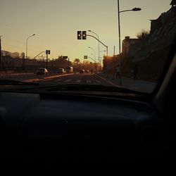 Cars on street seen through car windshield