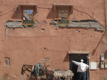 Low angle view of people working in old building