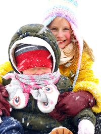 Portrait of a smiling girl in snow