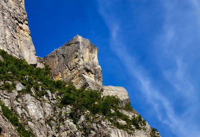 Low angle view of rock formation against sky