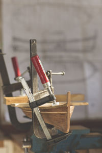 Close-up of clamps with boat model