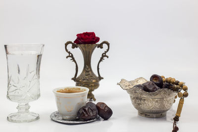 Close-up of coffee served on table against white background