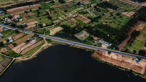 High angle view of river amidst agricultural field