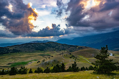 Scenic view of landscape against sky during sunset