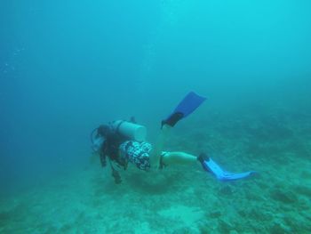 People scuba diving  in sea