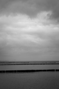 Bridge over sea against sky