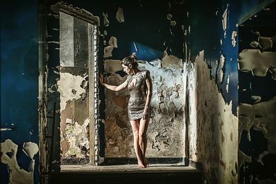 Young woman standing in front of building