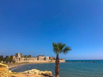 Scenic view of sea against clear blue sky