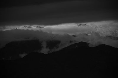 Low angle view of silhouette mountain against sky