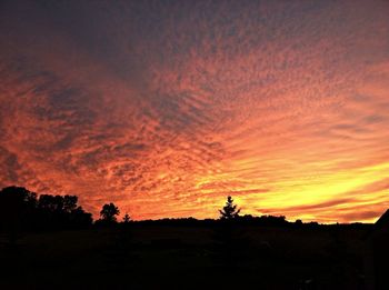 Silhouette of landscape against dramatic sky