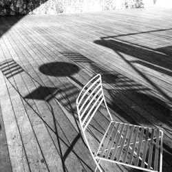 Empty chair on hardwood floor at cafe