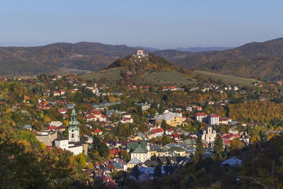 High angle view of townscape and mountains against sky