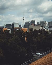 Communications tower against cloudy sky