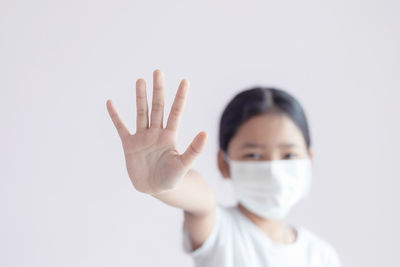 Portrait of human hand against white background