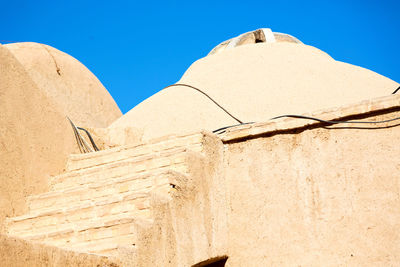 Low angle view of building against blue sky