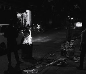 Man walking on street at night