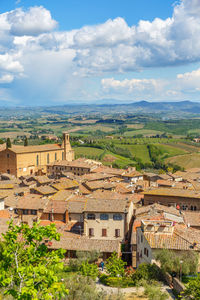 Aerial view of residential building in san gimignano with a rural landscape view in tuscany, italy