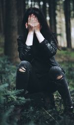 Woman sitting outdoors