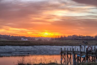 Scenic view of lake against sky during sunset