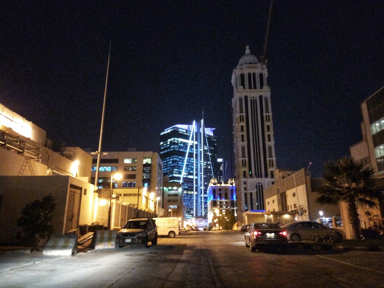 illuminated, night, architecture, transportation, built structure, building exterior, car, land vehicle, mode of transport, no people, city, sky, outdoors, clear sky, modern