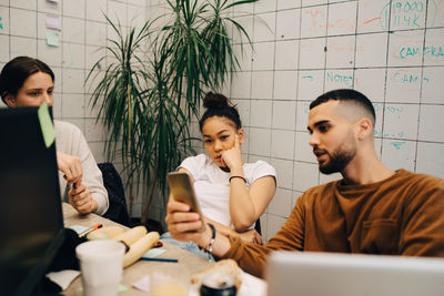 Friends working on table