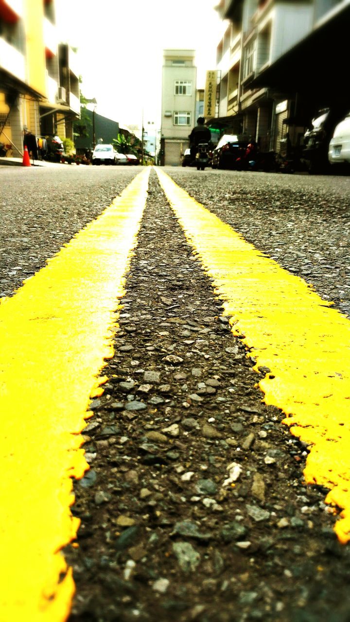 yellow, transportation, street, outdoors, the way forward, building exterior, city, built structure, surface level, no people, asphalt, architecture, textured, road, day, nature, sky, close-up