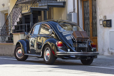 Bicycles parked on street by buildings