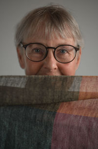 Portrait of woman behind object