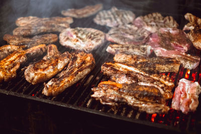 Roasted juicy meat cooked over the coals on a barbecue