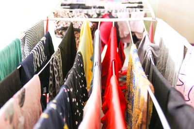 Close-up of multi colored clothes hanging in rack