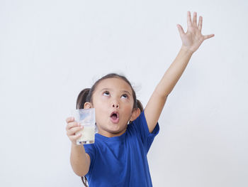 Portrait of boy against white background