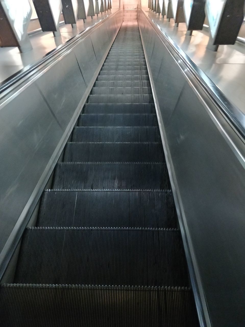 LOW ANGLE VIEW OF ESCALATOR IN ESCALATORS