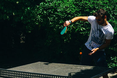 Young man playing table tennis