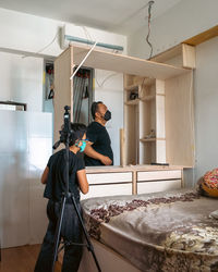 Wardrobe assembly in progress. diy at home. father and son.