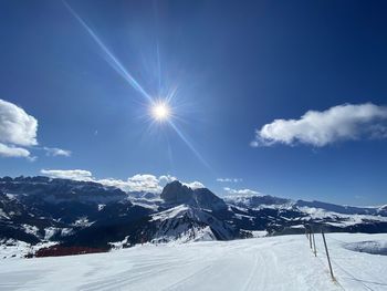 Scenic view of snow covered mountains against sky