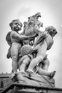 Low angle view of statue against sky