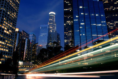 Illuminated modern buildings in city at night