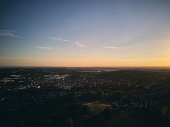 High angle view of buildings against sky during sunset