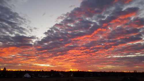 Scenic view of dramatic sky during sunset