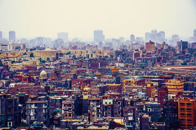 Scenic view of town against clear sky