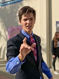 Portrait of young man gesturing