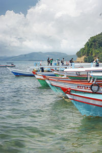 View of boats in sea against sky