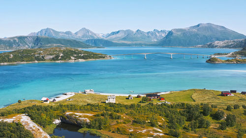 High angle view of townscape by sea against sky