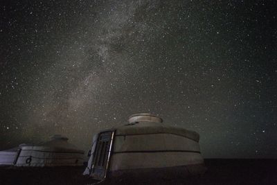 Low angle view of building against sky at night