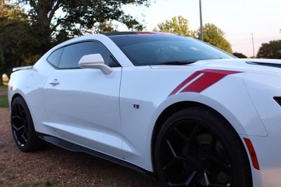 Side view of car parked on road