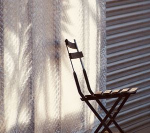 Close-up of a chair on street 