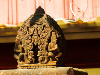 Close-up of statues outside temple