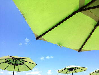 Low angle view of umbrella against sky