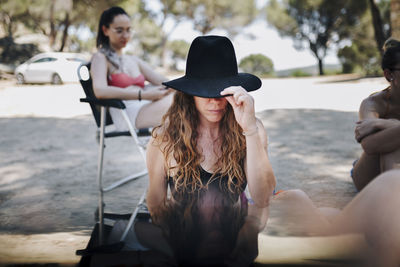 Portrait of young woman in hat