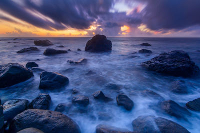 Scenic view of sea against sky at sunset